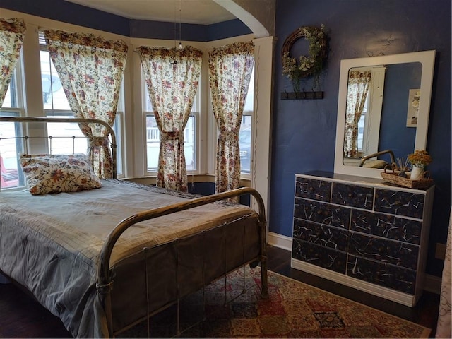 bedroom featuring dark hardwood / wood-style flooring