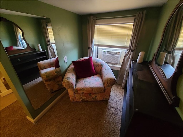 sitting room featuring dark colored carpet