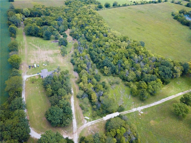 birds eye view of property with a rural view