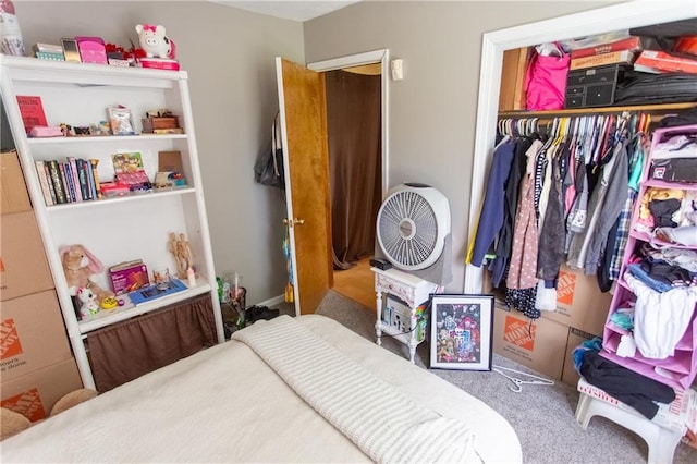 carpeted bedroom with a closet