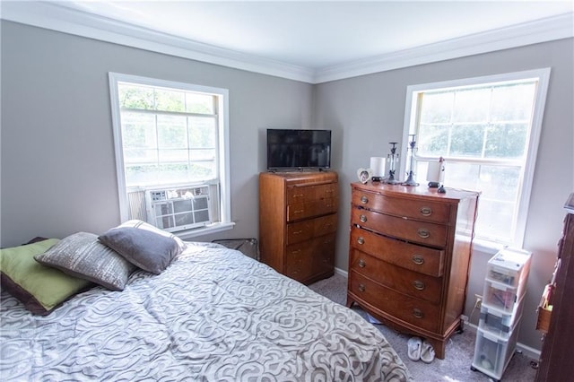 carpeted bedroom featuring crown molding