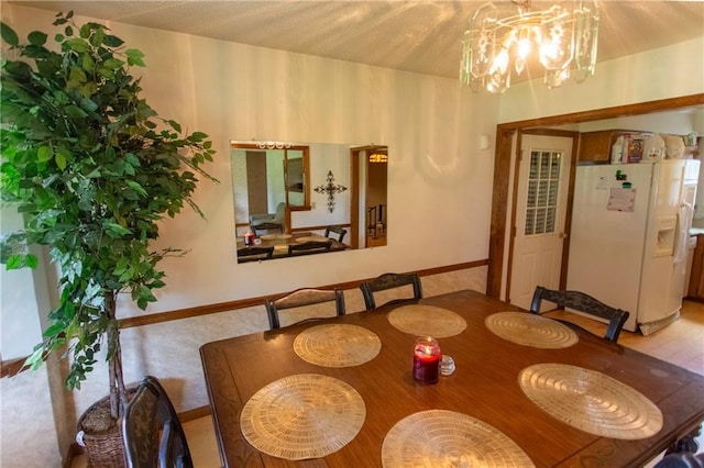 dining space with a chandelier