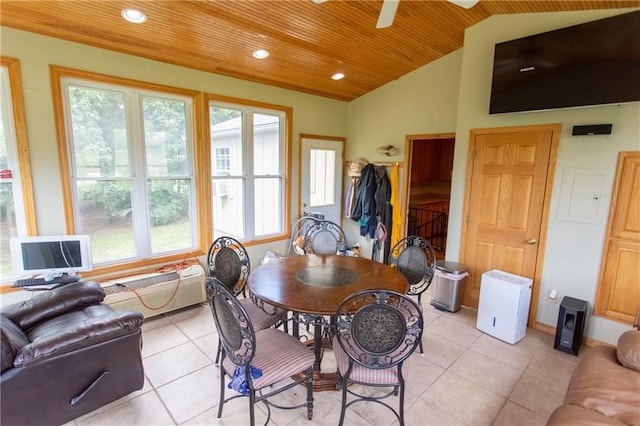 tiled dining space featuring vaulted ceiling, ceiling fan, and a wealth of natural light