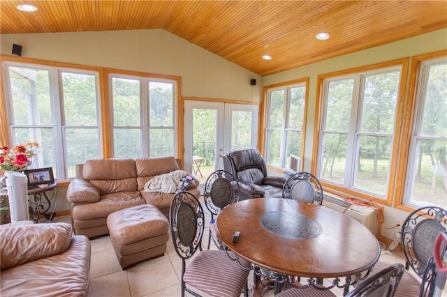 sunroom / solarium featuring french doors, a healthy amount of sunlight, and lofted ceiling