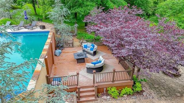 29800 E 65th St, Blue Springs, MO 64014 - wooden deck featuring an outdoor pool and an outdoor living space