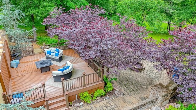 29800 E 65th St, Blue Springs, MO 64014 - wooden terrace featuring an outdoor living space