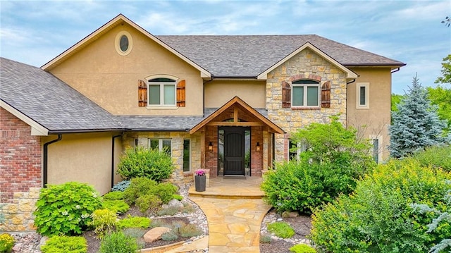 29800 E 65th St, Blue Springs, MO 64014 - craftsman inspired home with stone siding, stucco siding, and a shingled roof