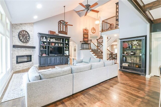 29800 E 65th St, Blue Springs, MO 64014 - living area with ceiling fan, stairs, a fireplace, healthy amount of natural light, and high vaulted ceiling