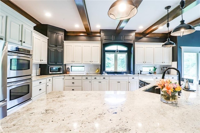 29800 E 65th St, Blue Springs, MO 64014 - kitchen with a sink, stainless steel appliances, tasteful backsplash, light stone countertops, and beam ceiling