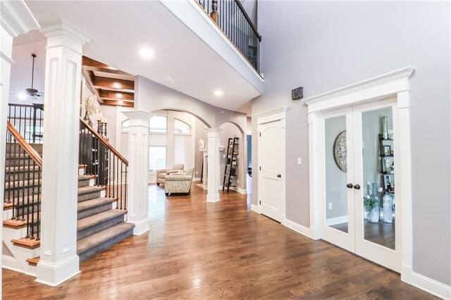 29800 E 65th St, Blue Springs, MO 64014 - entryway featuring decorative columns, french doors, wood finished floors, stairway, and baseboards