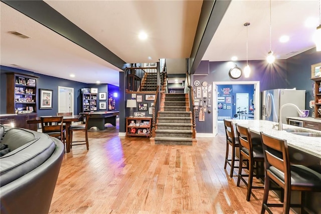29800 E 65th St, Blue Springs, MO 64014 - dining room with stairway, light wood finished floors, recessed lighting, and baseboards