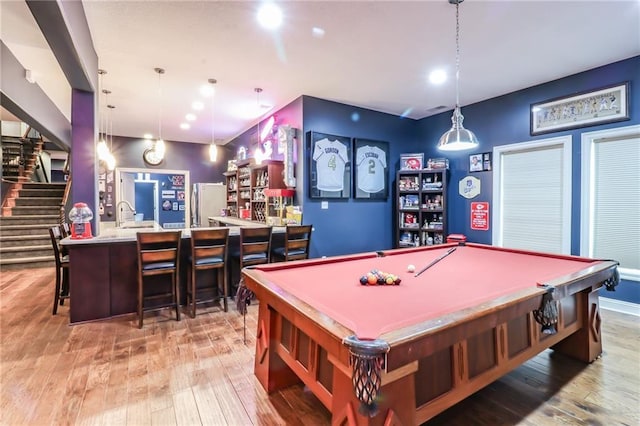 29800 E 65th St, Blue Springs, MO 64014 - playroom with billiards, wood-type flooring, recessed lighting, and bar
