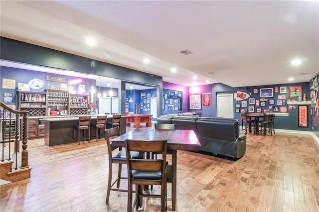 29800 E 65th St, Blue Springs, MO 64014 - dining area featuring a bar, light wood-style floors, recessed lighting, and stairs