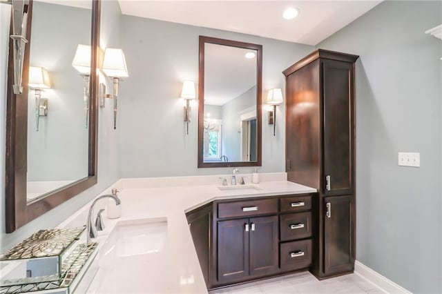 29800 E 65th St, Blue Springs, MO 64014 - full bath featuring double vanity, recessed lighting, and baseboards