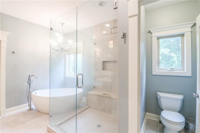 29800 E 65th St, Blue Springs, MO 64014 - bathroom with a soaking tub, baseboards, a shower stall, toilet, and a chandelier