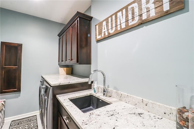 29800 E 65th St, Blue Springs, MO 64014 - laundry area featuring cabinet space, independent washer and dryer, and baseboards