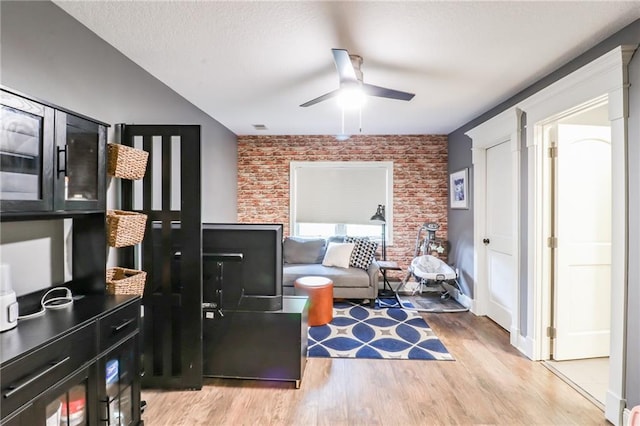 29800 E 65th St, Blue Springs, MO 64014 - sitting room with light wood-type flooring, brick wall, and a ceiling fan