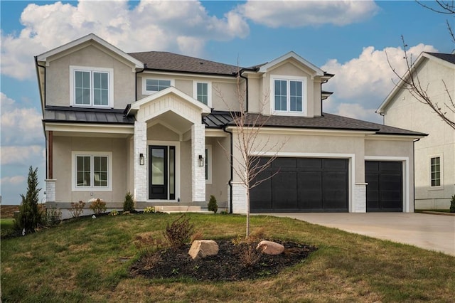 view of front of home with a garage and a front lawn