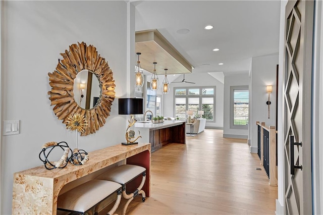 13704 Pembroke Ln, Leawood, KS 66224 - interior space with a peninsula, fridge, recessed lighting, light countertops, and light wood-style flooring