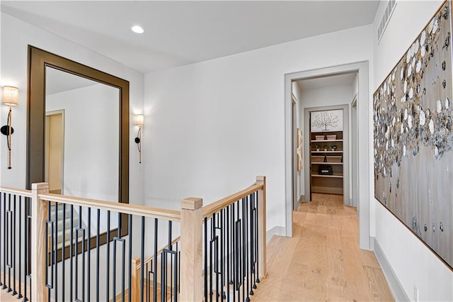 13704 Pembroke Ln, Leawood, KS 66224 - hallway with recessed lighting, visible vents, an upstairs landing, and light wood-type flooring