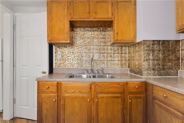 kitchen featuring backsplash and sink