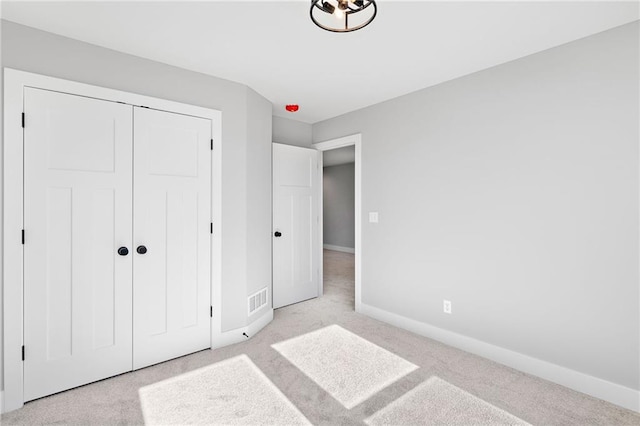 carpeted bedroom featuring a closet