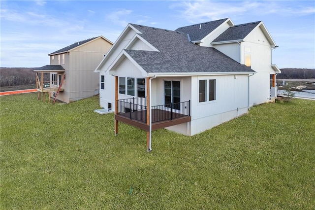 rear view of house with a yard