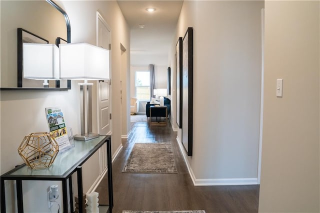 hallway featuring dark hardwood / wood-style floors