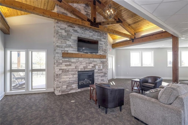 living room featuring high vaulted ceiling, dark carpet, a notable chandelier, beamed ceiling, and a fireplace