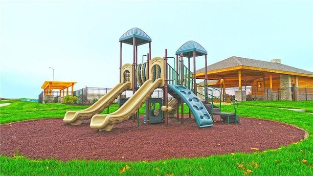 community playground featuring a lawn