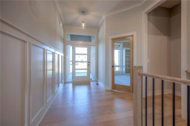 hallway with ornamental molding and wood-type flooring