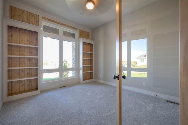 spare room with french doors and carpet flooring