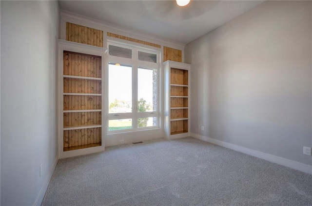 unfurnished room featuring carpet flooring