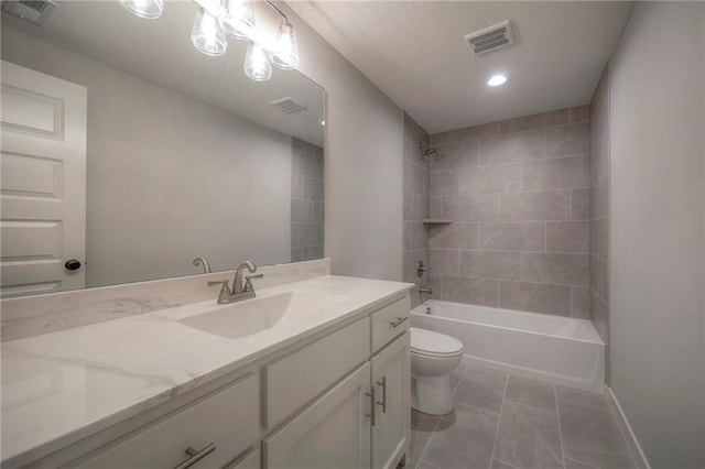 full bathroom with tiled shower / bath combo, vanity, and toilet