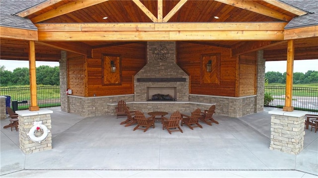 view of patio / terrace with an outdoor stone fireplace