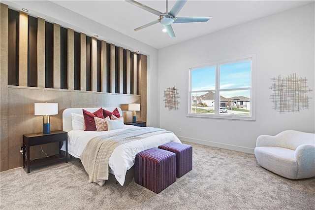 bedroom with ceiling fan and light colored carpet