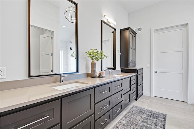 bathroom with vanity and an inviting chandelier