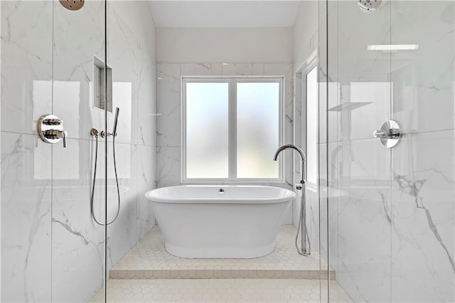 bathroom with tile patterned floors and plus walk in shower