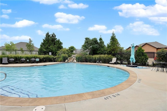 view of swimming pool with a patio area