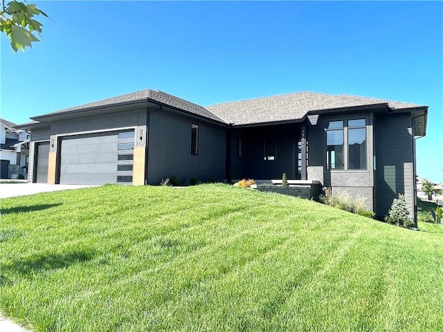 17321 Gillette St, Overland Park, KS 66221 - prairie-style house featuring an attached garage, a front lawn, and concrete driveway