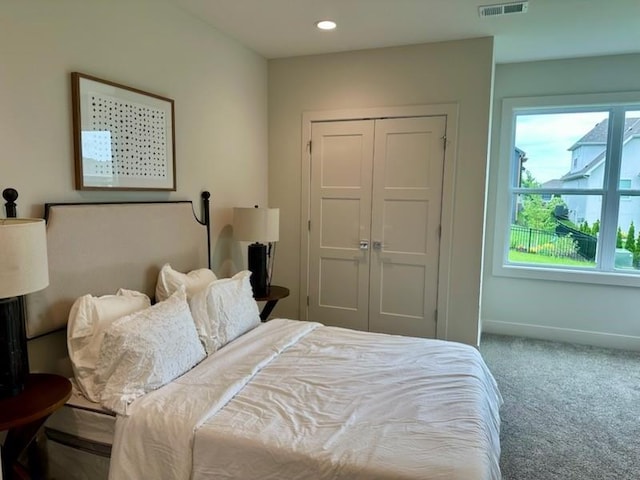 17321 Gillette St, Overland Park, KS 66221 - bedroom featuring carpet floors, multiple windows, a closet, and recessed lighting