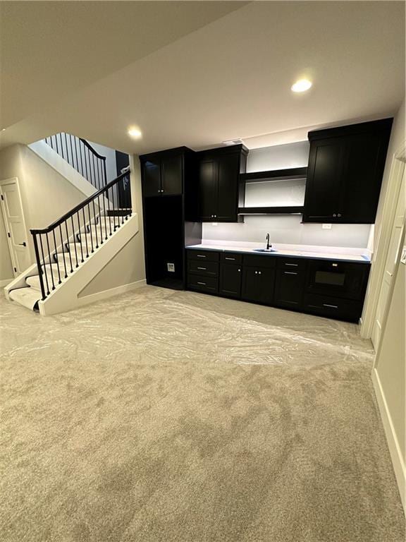 kitchen with sink and light carpet