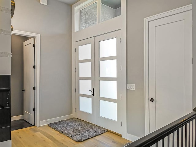 entrance foyer with wood-type flooring and french doors