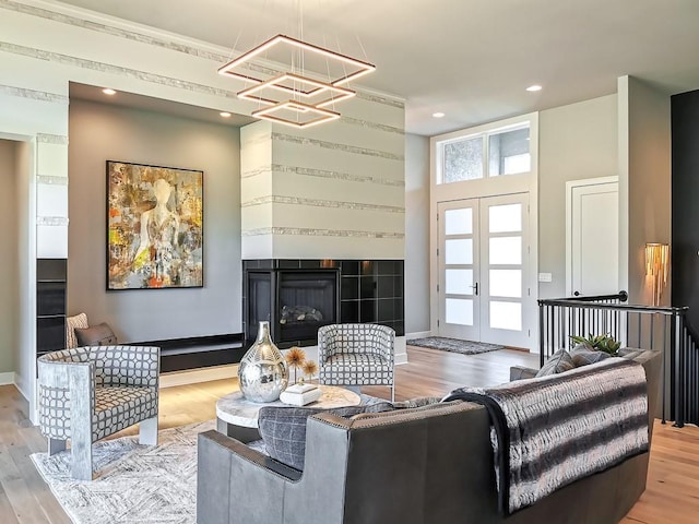 living room featuring light hardwood / wood-style floors and french doors