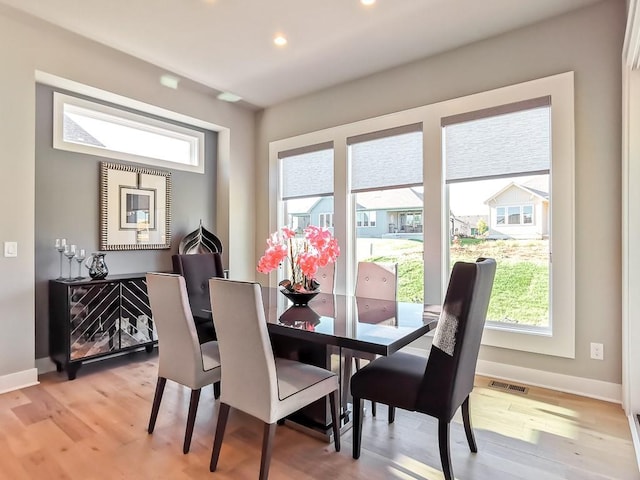 dining space featuring light hardwood / wood-style floors