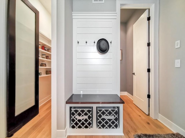 mudroom with hardwood / wood-style floors