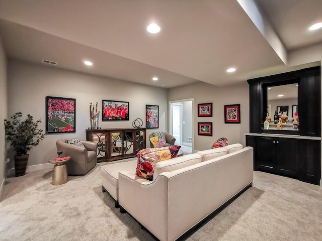 carpeted living room with bar area