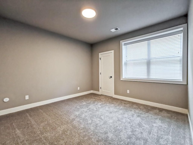 empty room featuring carpet floors