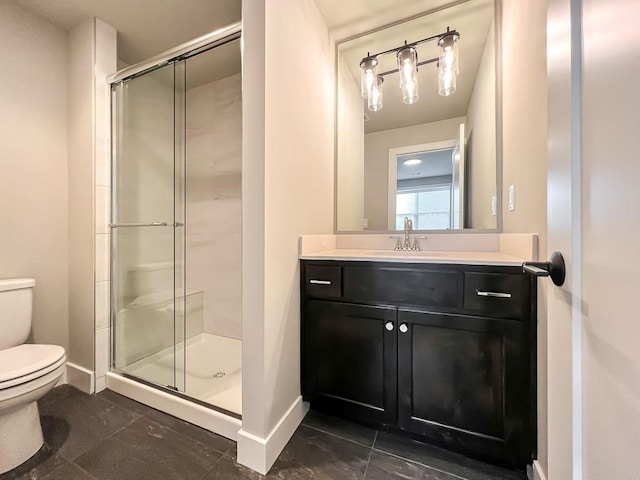 bathroom featuring vanity, toilet, and walk in shower