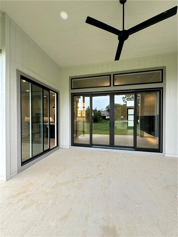 view of patio featuring ceiling fan